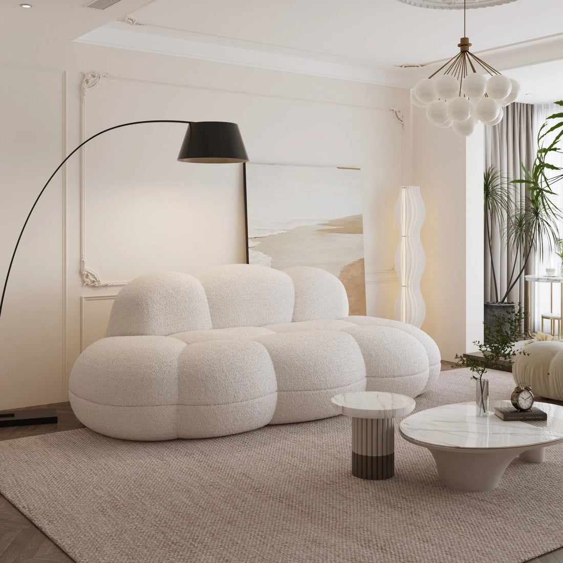 Modern living room with a cloud-shaped white sofa, floor lamp, and abstract painting.